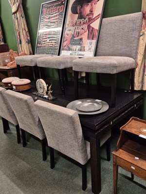 Lot 924 - A 20th-century ebonised rectangular dining...