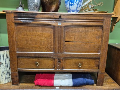Lot 928 - An 18th century oak mule chest, the two panels...