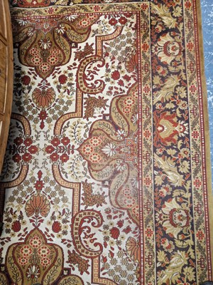 Lot 1516 - A machine made carpet of Persian design. 369 x...