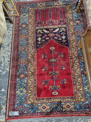 Lot 1517 - A machine made rug of Turkish prayer design...