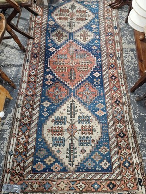 Lot 1518 - An antique Turkish tribal rug. 241 x 110 cm