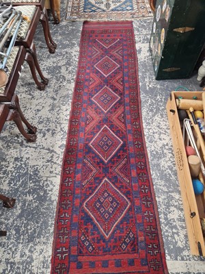 Lot 1519 - A tribal mixed technique runner 273 x 60 cm