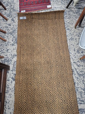 Lot 1520 - A natural fibre runner 200 x 86 cm
