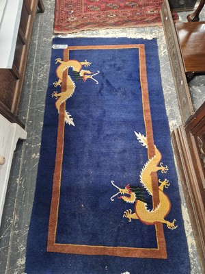 Lot 1526 - A Tibetan dragon rug 189 x 92 cm