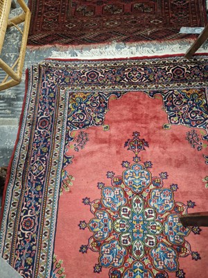 Lot 1528 - An oriental rug of tribal design 190 x 124 cm