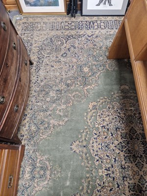 Lot 1530 - A machine made carpet of Persian design 456 x...
