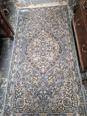 Lot 1536 - A machine made rug of Persian design 175 x 90 cm