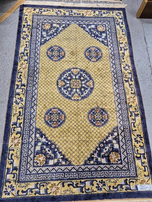 Lot 1546 - An oriental rug of Chinese design 241 x 148 cm