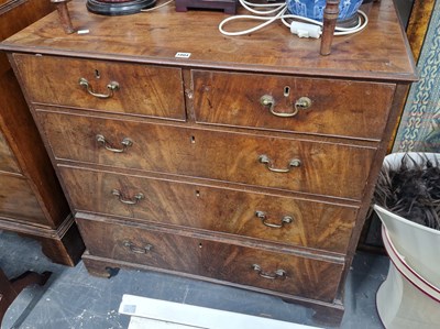 Lot 1004 - A Georgian Mahogany chest of two short and...