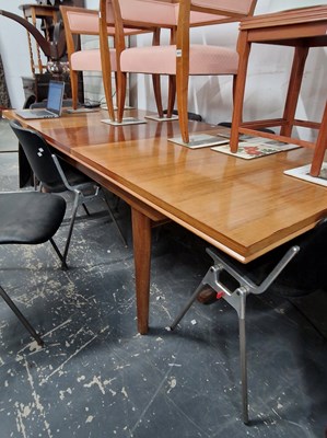 Lot 1017 - A large mid century / retro extending dining...