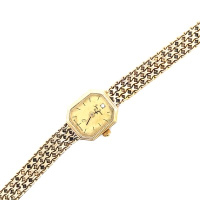 Lot 102 - A ladies Jean Jacot gold wristwatch. The strap...