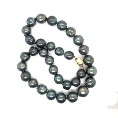 Lot 28 - A Tahitian graduated pearl necklace complete...