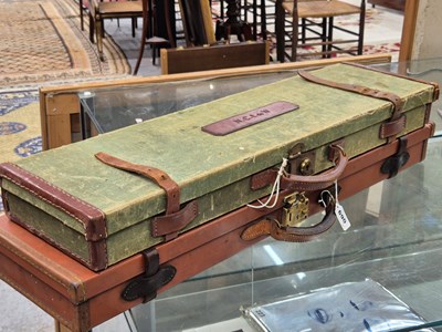 Lot 690 - A vintage Canvas and leather shotgun case and...