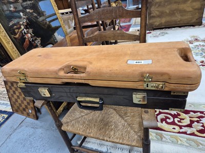 Lot 691 - A Berretta leather covered hard shell shotgun...