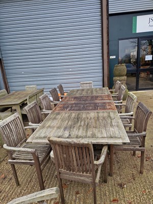 Lot 707 - A Vintage Weathered Teak patio table with...