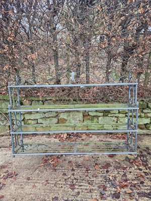 Lot 725 - A wrought iron and brass-mounted wall shelf...