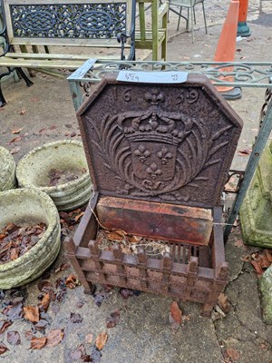 Lot 729 - A vintage iron fire grate