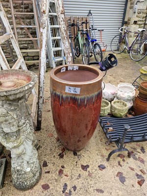 Lot 739a - A tall red glazed garden planter.