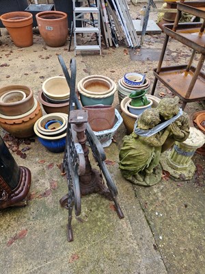 Lot 744a - A pair of cast iron bench ends and an iron...