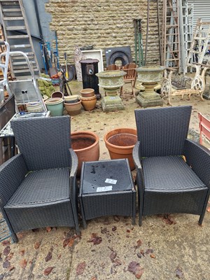 Lot 755 - A pair of patio armchairs and matching glass...