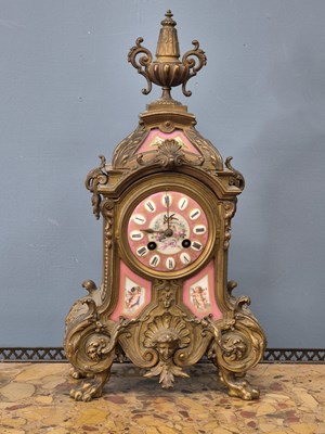 Lot 654 - A Victorian gilt brass Mantle clock with Inset...