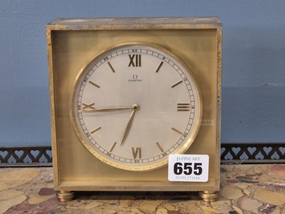 Lot 655 - A rare Omega desk clock in a gold anodised...