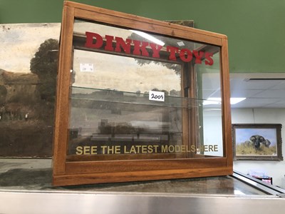 Lot 2009 - A glazed mahogany Dinky Toys shop display cabinet