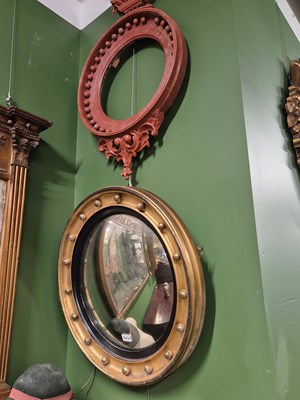 Lot 2037 - A convex mirror in a gilt beaded frame...