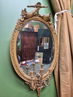 Lot 2049 - A gilt framed oval girandole mirror with three...