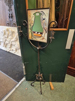 Lot 2055 - A wrought iron floor standing mirror with two...