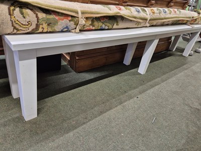 Lot 2062 - A white painted long bench.   W 264cms
