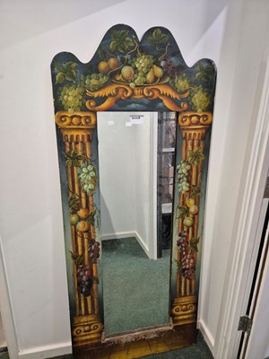 Lot 2068 - A full length mirror in a green ground frame...
