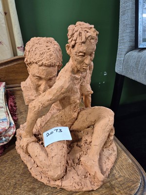 Lot 2073 - A sculpted terracotta figure of a seated nude...
