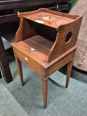 Lot 2078 - A mahogany bedside table, the upper shelf...