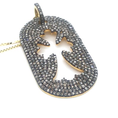 Lot 53 - A diamond set open work cross pendant and...
