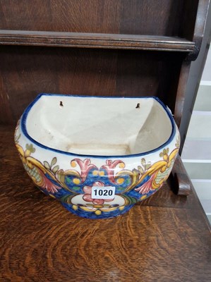 Lot 1020 - A continental pottery wall mounted planter.