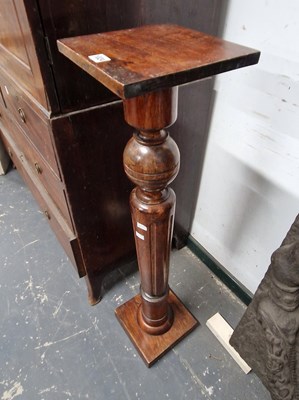 Lot 1024 - A mahogany torchere.