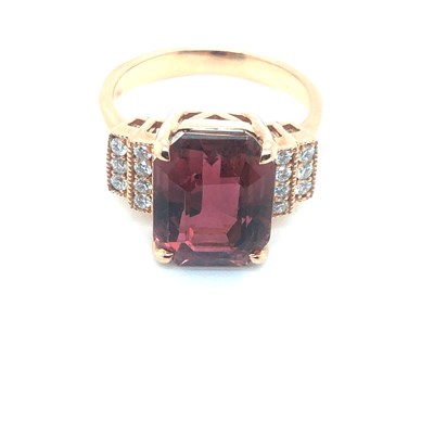 Lot 55 - A pink tourmaline and diamond ring. The...