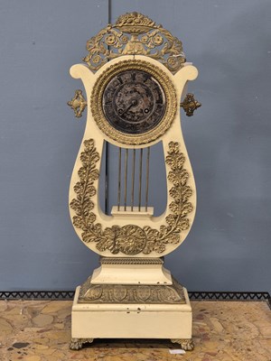 Lot 831 - A 19th-century Louis Phillipe Lyre form clock ....