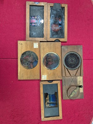 Lot 212 - A collection of antique hand-coloured magic...