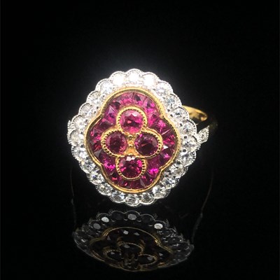 Lot 139 - A Victorian-style quatrefoil ring set with red...