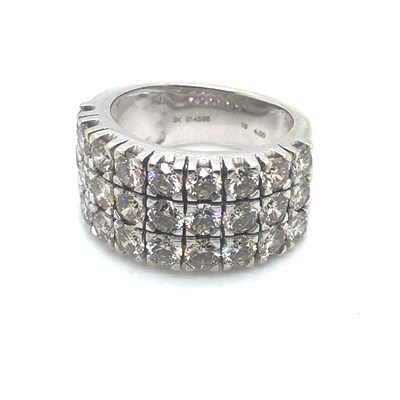 Lot 136 - A 9ct hallmarked white gold band set with...