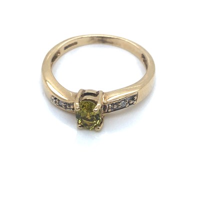 Lot 121 - A 9ct hallmarked gold oval green tourmaline...