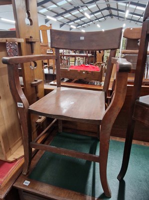 Lot 1034 - An oak armchair.