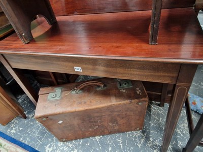 Lot 1042 - A George III mahogany fold over tea table on...
