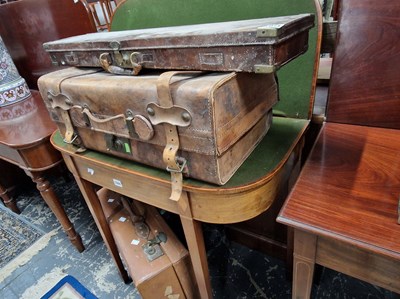 Lot 1043 - An antique brass bound leather shotgun case...