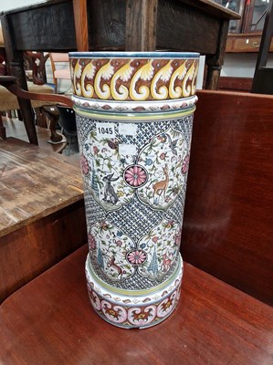 Lot 1045 - A continental pottery stick stand.