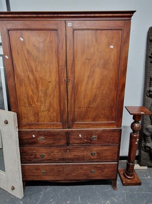 Lot 1048 - A George III mahogany linen press, converted...