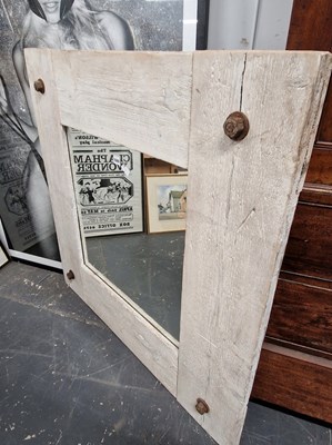 Lot 1049 - A designer rustic style pine framed mirror.