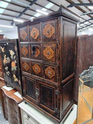 Lot 1052 - A Chinese spice chest of nine drawers over...